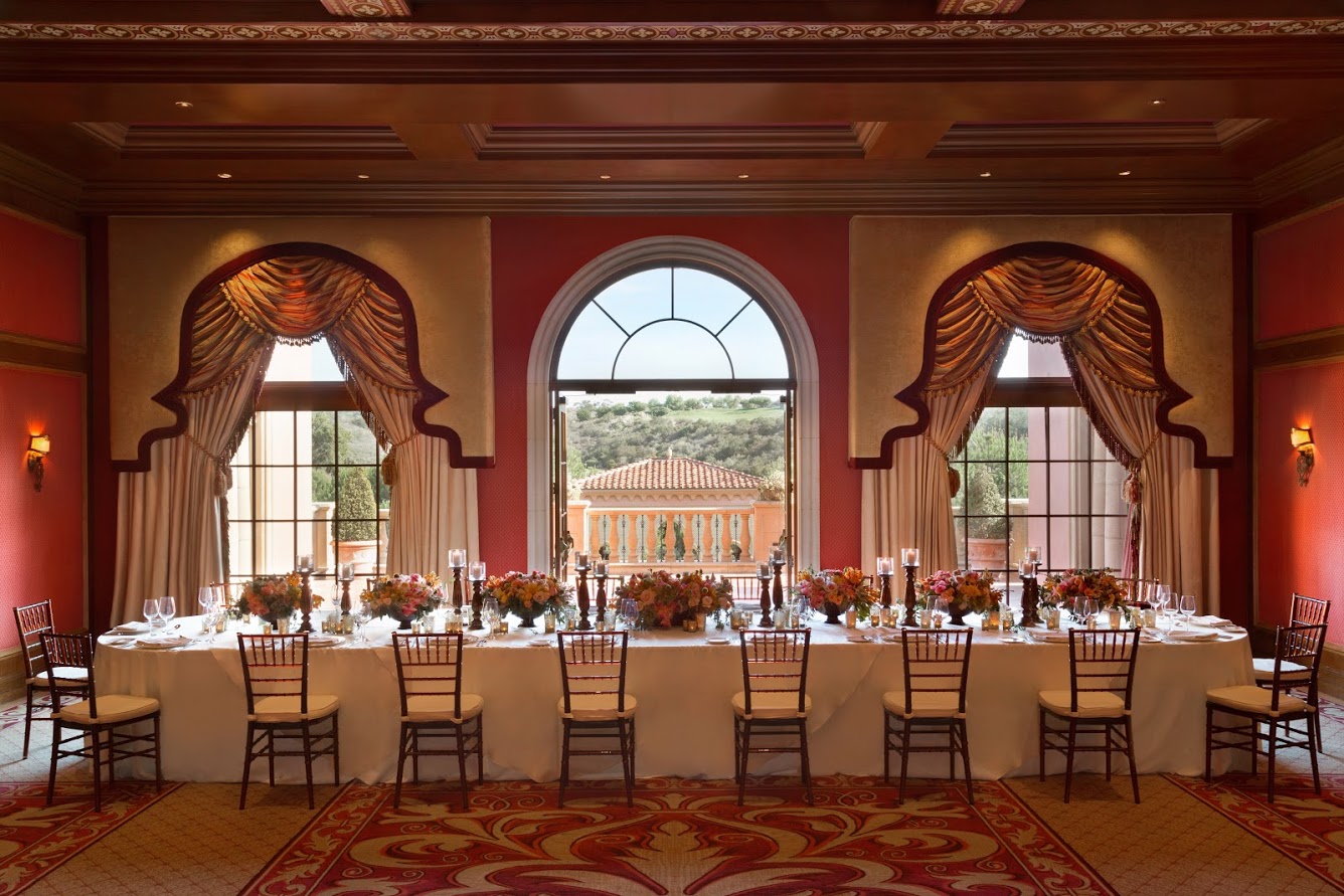 Long rectangular table along three picture windows that look out over Grand Del Mar