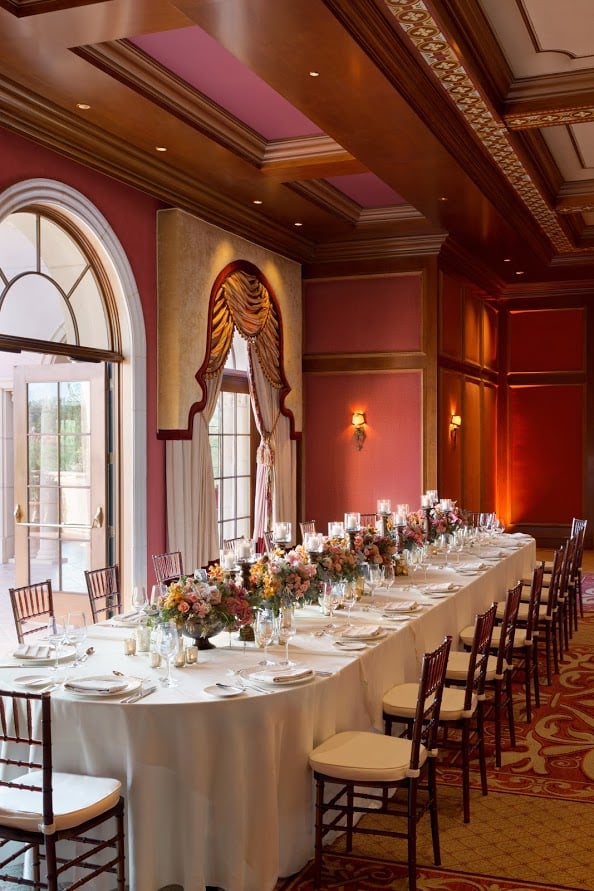 Long table set with flowers and plain white dishwear
