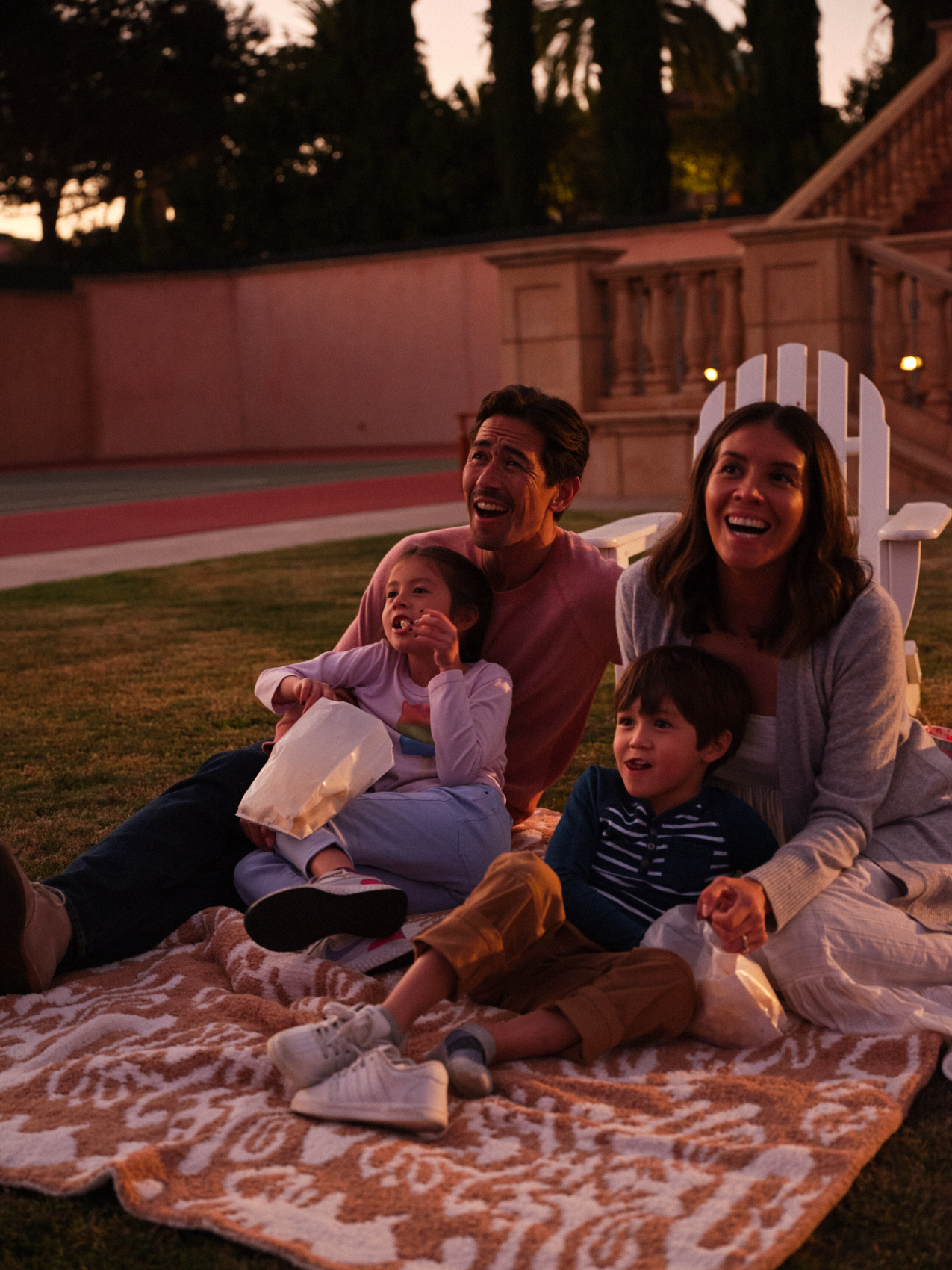 family outdoors stargazing