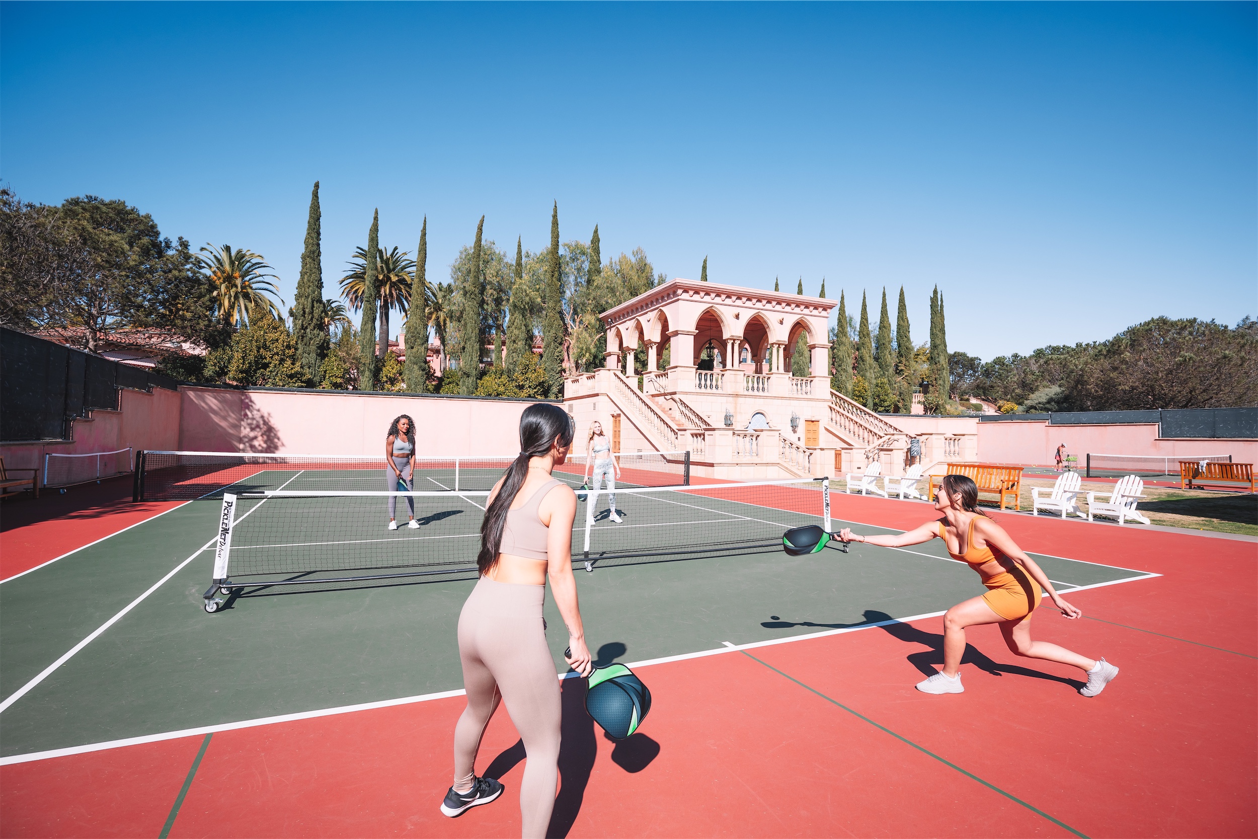 Women playing pickleball