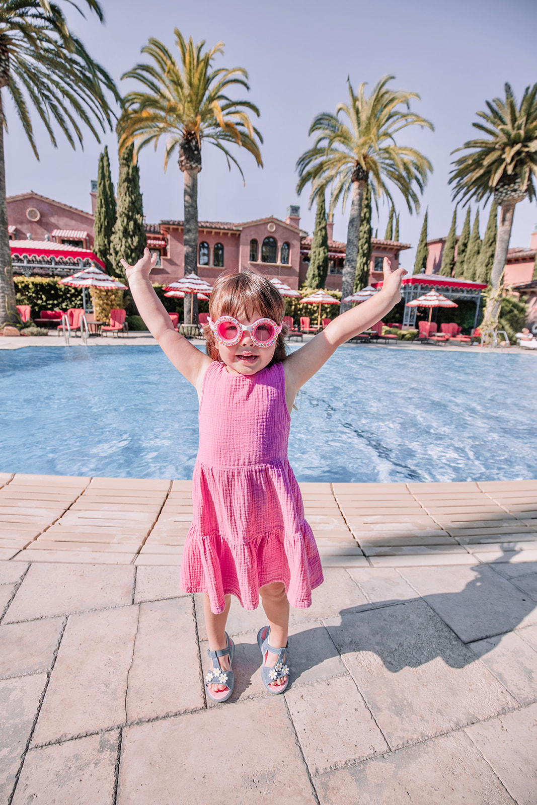 little girl by the pool