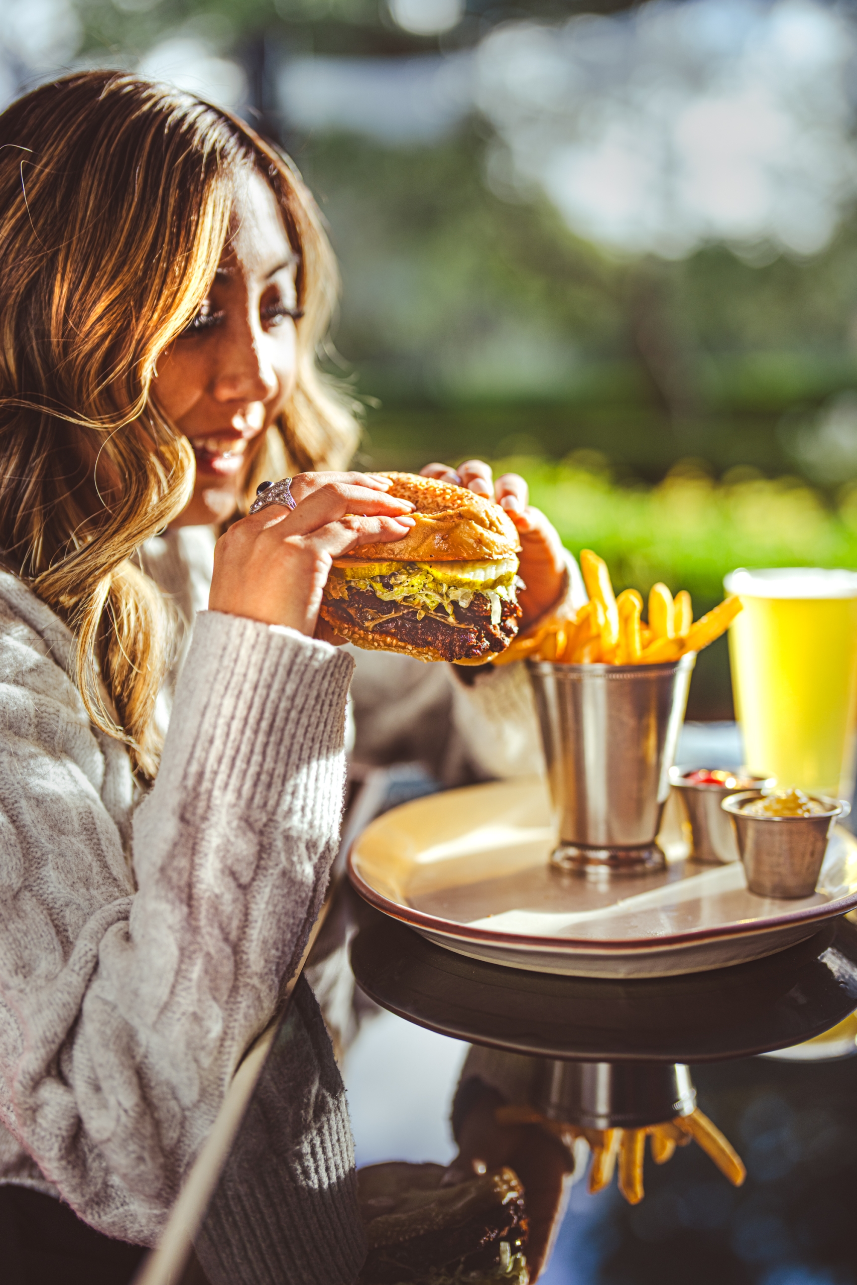Woman with Burger and Beer