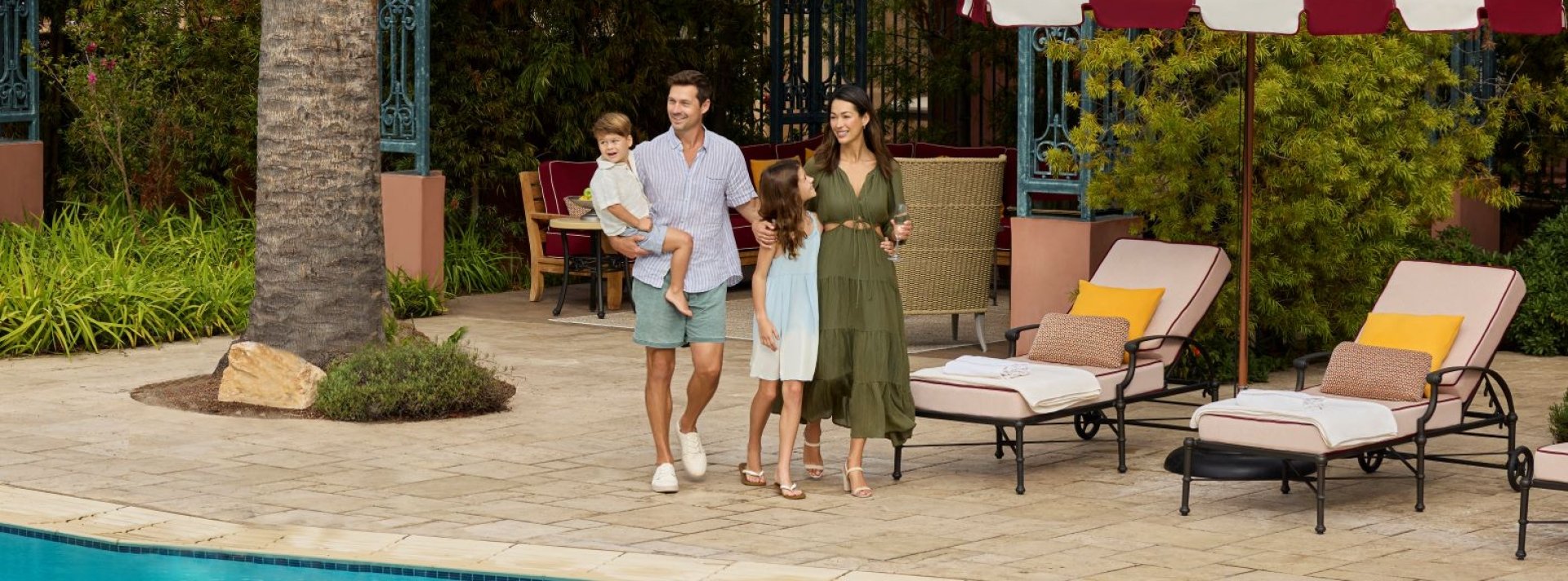 family at resort pool cabana