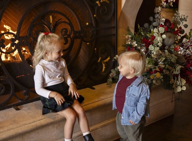 Kids by fireplace in the Lobby of Grand Del Mar
