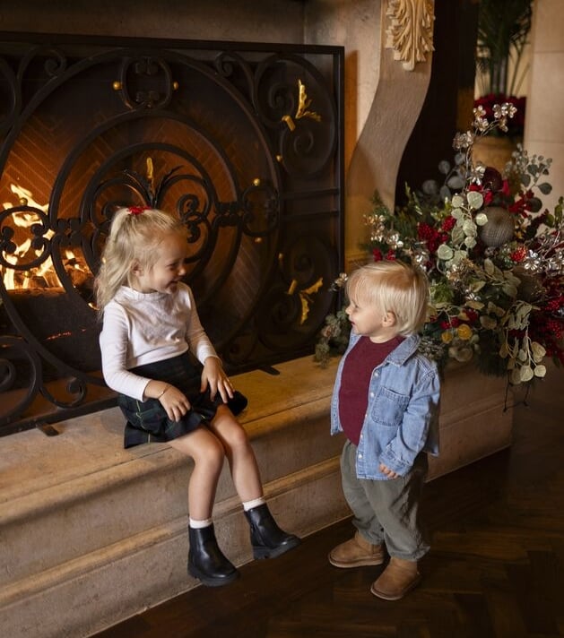 Kids by fireplace in the Lobby of Grand Del Mar